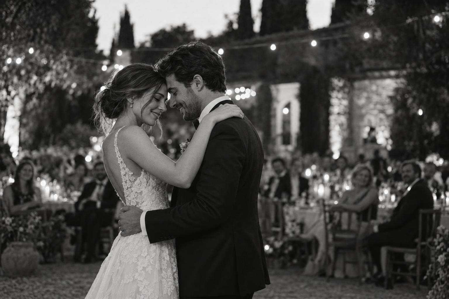 Bride and groom sharing their first dance in black and white.